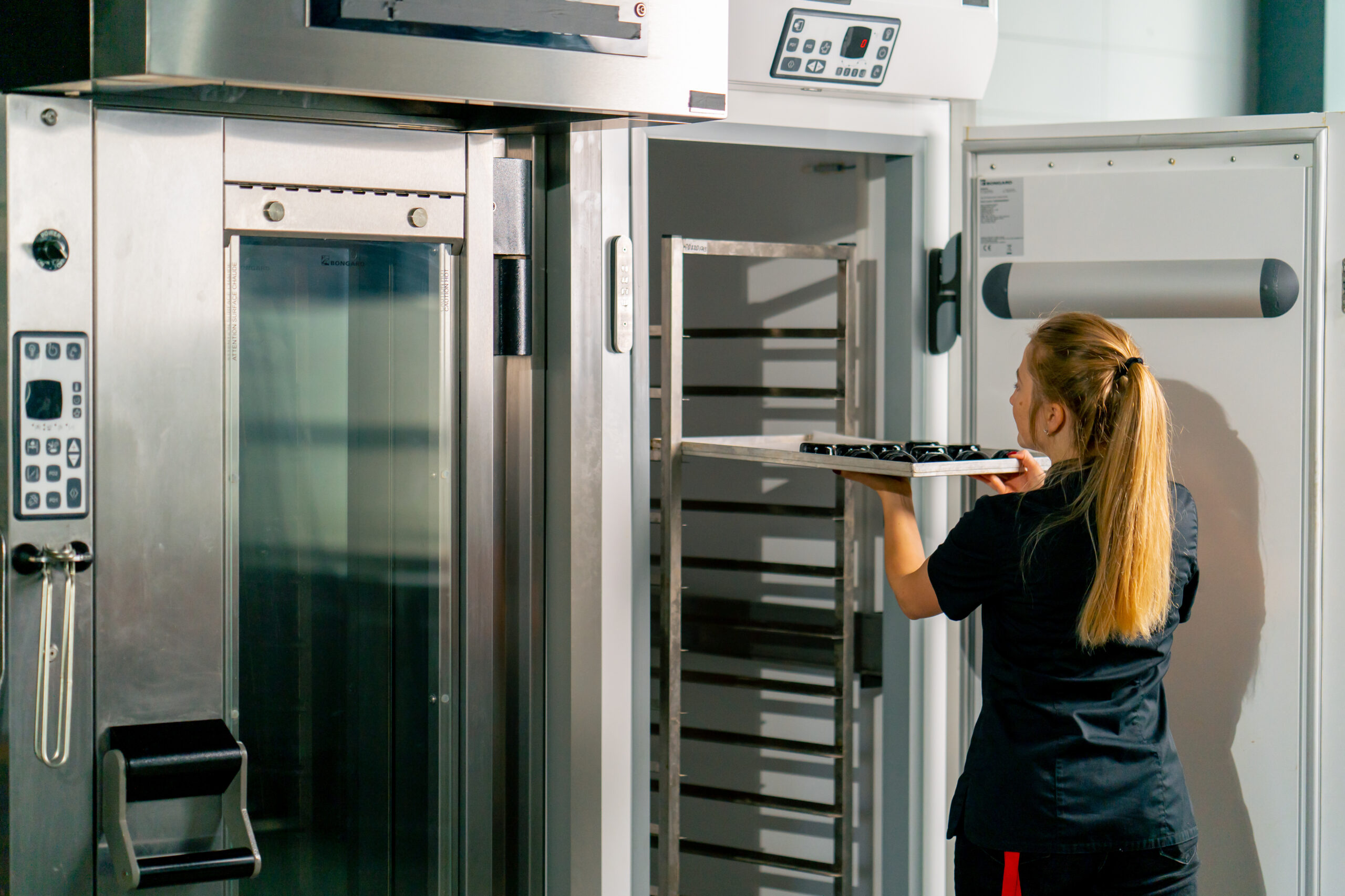 woman using commercial refrigerator